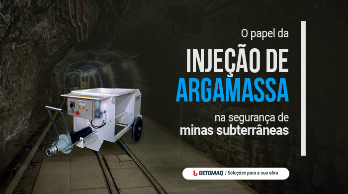 Máquina de injeção de argamassa posicionada em túnel subterrâneo, usada para reforço estrutural e segurança em obras de mineração.